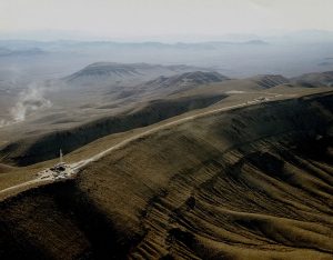 Aerial shot of a desert mountain.