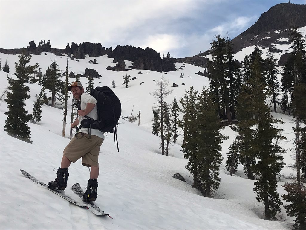 A skier skins uphill in the Sierra Nevada.