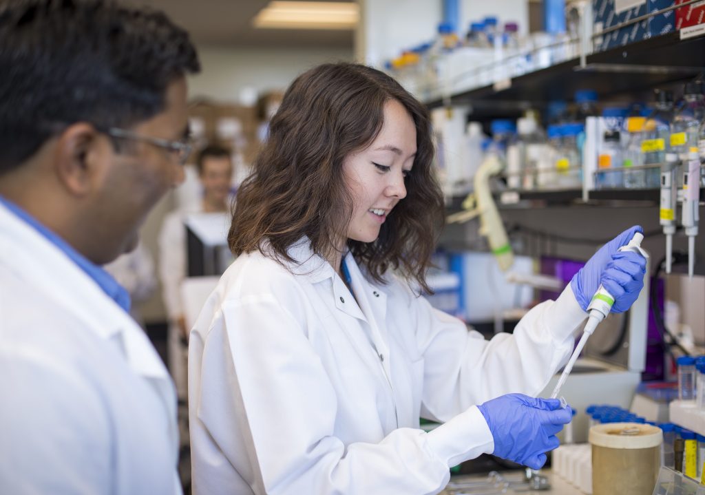 Scientists in a UNR lab working on SARS-CoV-2 research