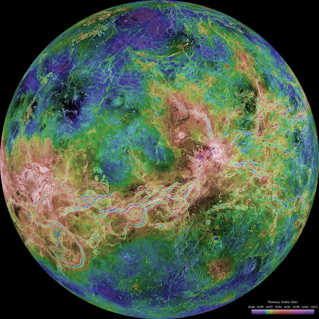 A very colorful view of the planet Venus. Lines of brown and green mix with blue and green splotches to make up the planet.