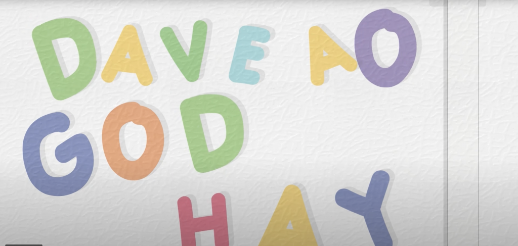 Colored refrigerator magnets spell out, "DAVE AO GOD HAY."