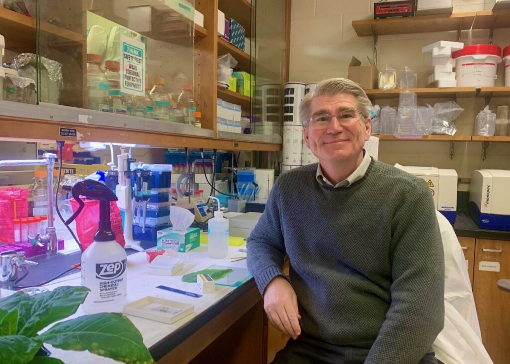 Professor John Cushman sits in lab at UNR