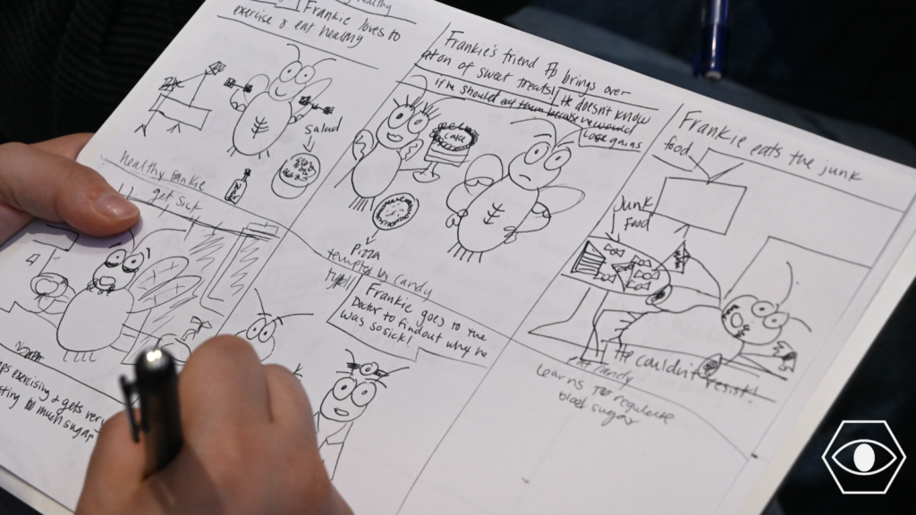 A student works on a science cartoon