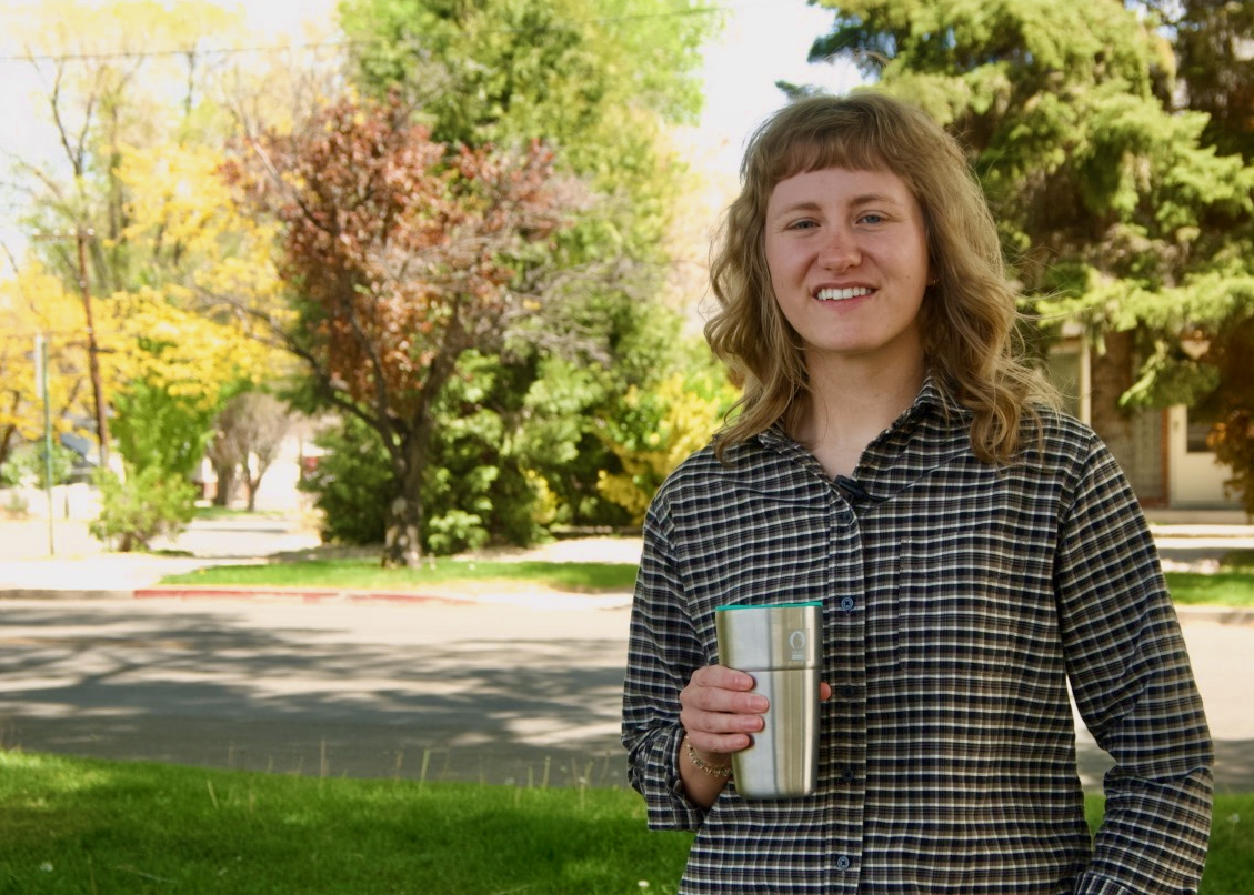 woman holding coffee cup