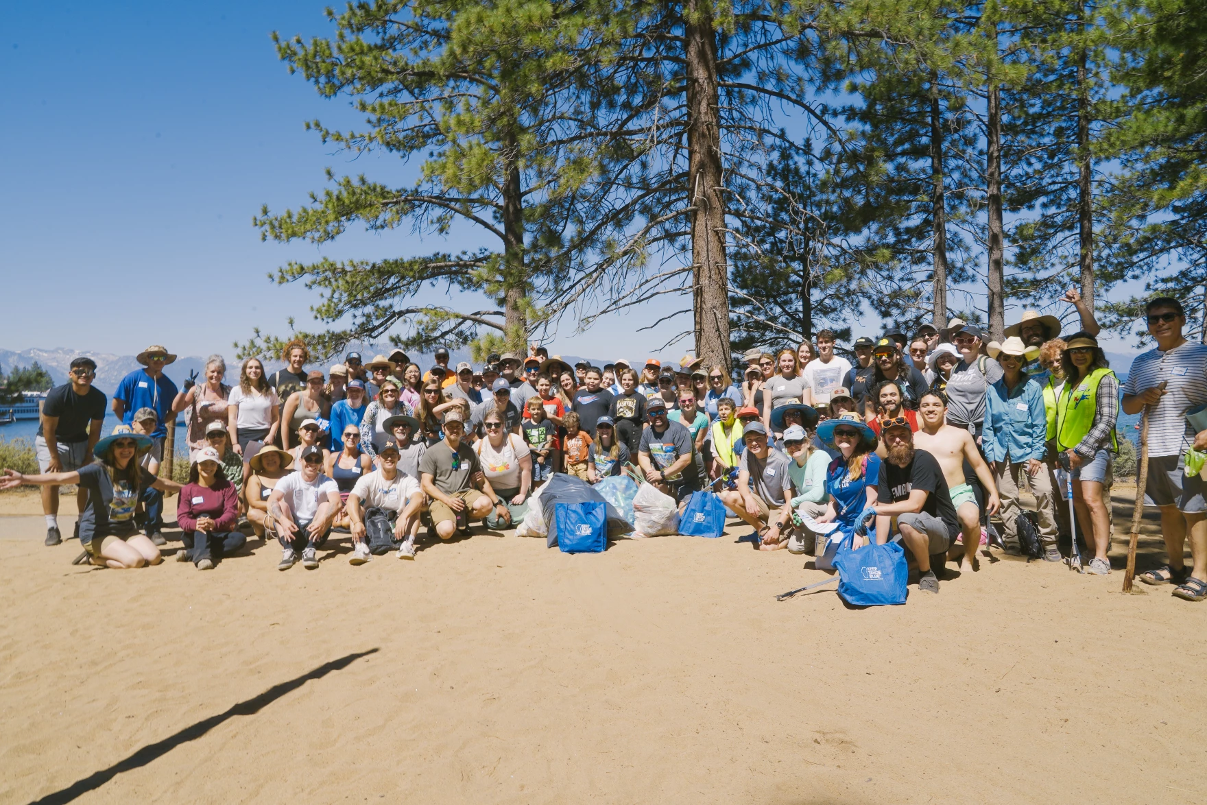 Volunteers pose for a photo on July 5, 2024, at the annual “Keep Tahoe Red, White and Blue” beach cleanup. Credit: League to Save Lake Tahoe