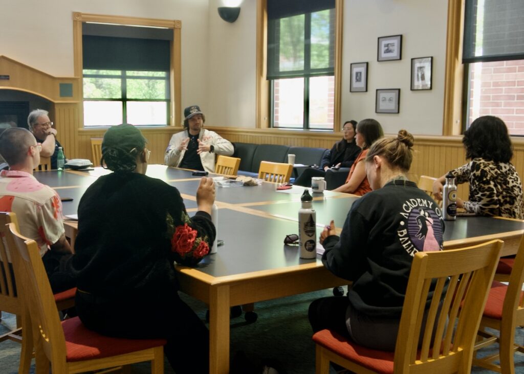 James Tralie talks with students in the RSJ reading room