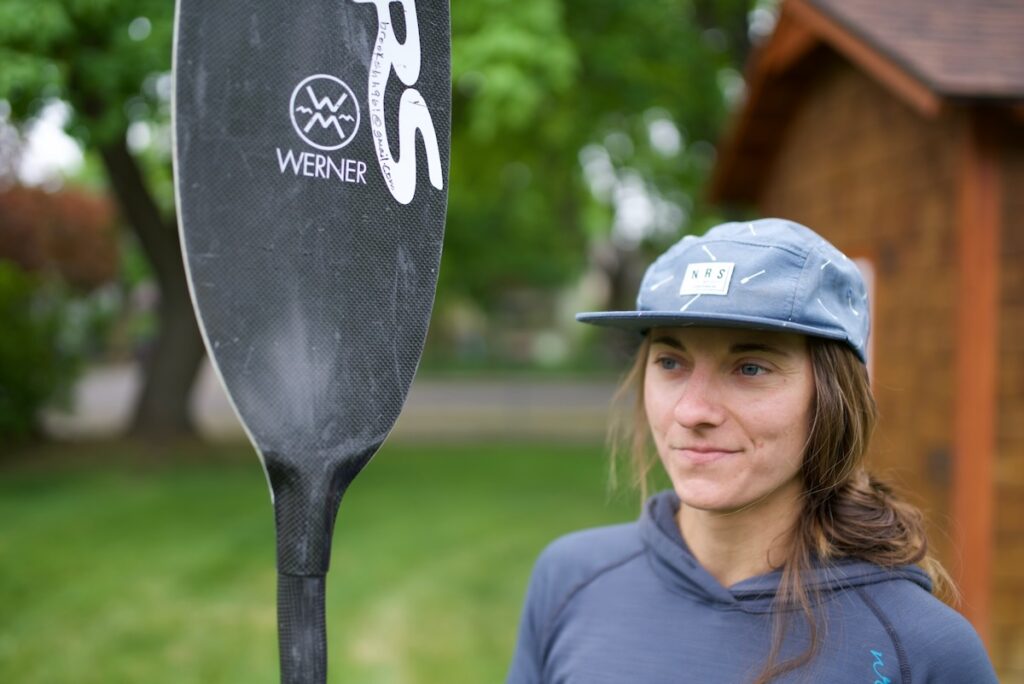 Head shot of Brooke Hess holding kayak paddle