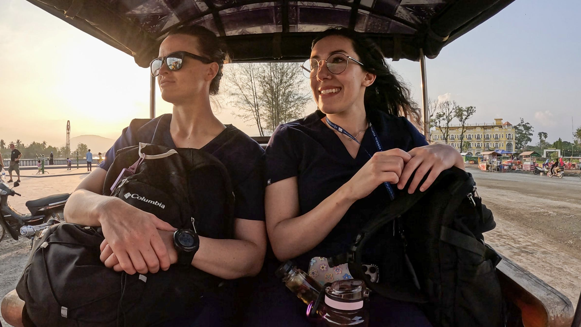 two women sit in a tuk tuk in cambodia