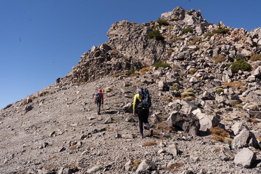 The research team hikes up a rocky slope at Lassen Volcanic Park