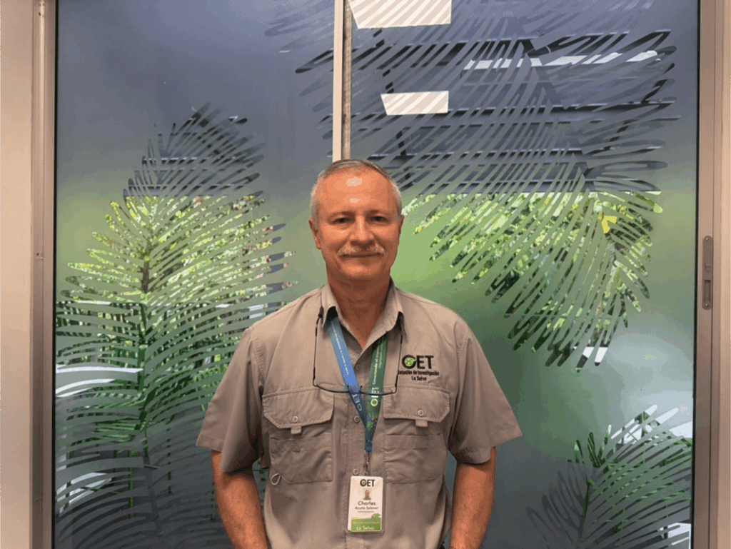 Charles Acuńa Salazar standing in front of window