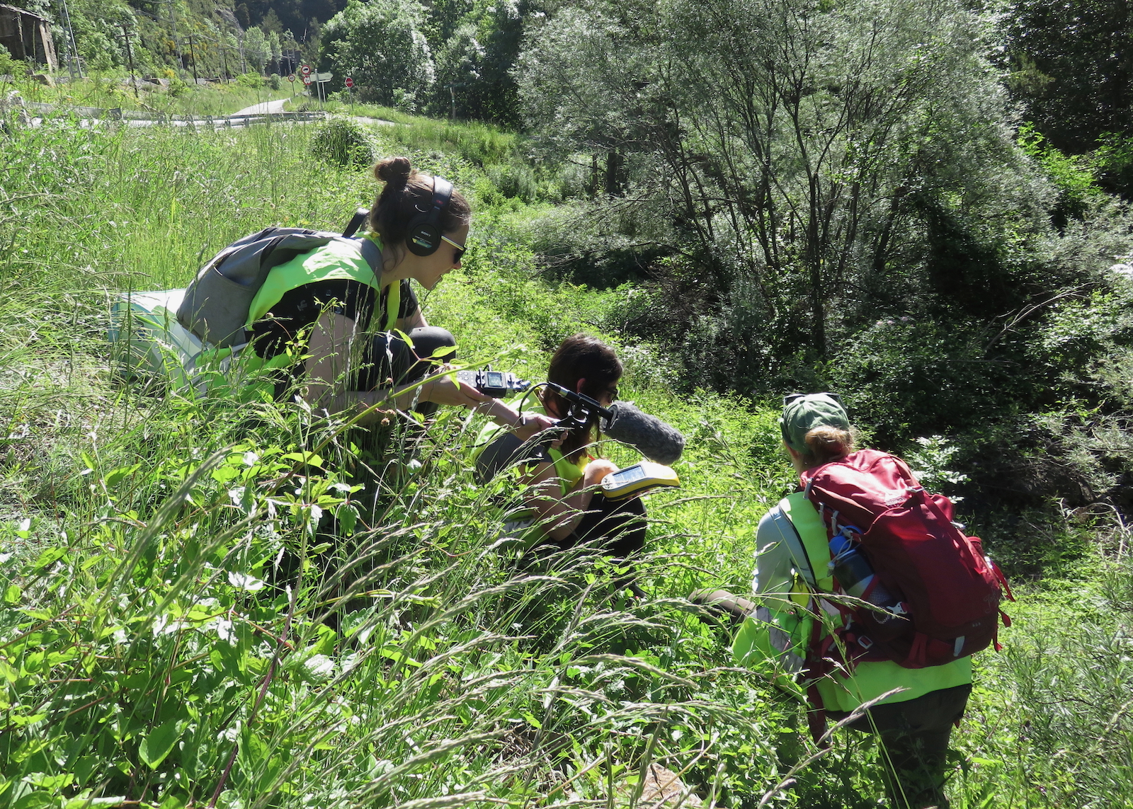 Lindsay patterson recording audio of scientists in the Pyrenees