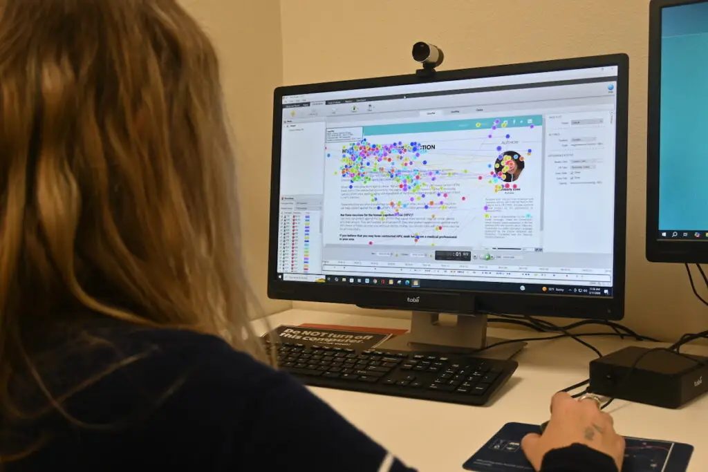 researcher works in the eye tracking lab at UNR