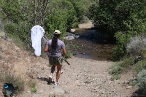 Victoria Peechatt carries butterfly net along Hunter Creek trail
